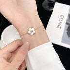 [Marin]BRACELET FLEUR DE PRUNIER EN NACRE BLANCHE PORTE-BONHEUR
